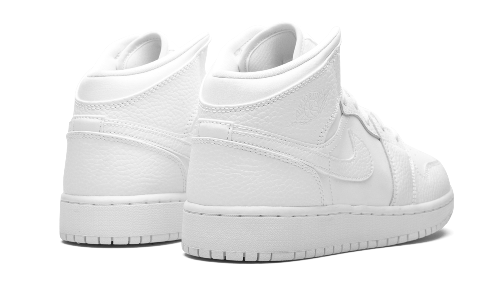 jordan 1 mid triple white tumbled leather gs+554725-130+diagnol right behind view