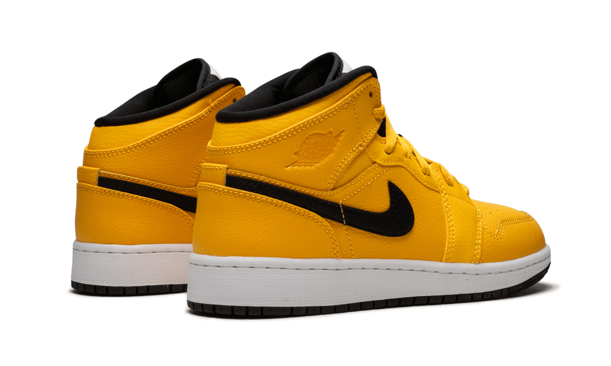jordan 1 mid university gold black gs+554725-700+diagnol right behind view