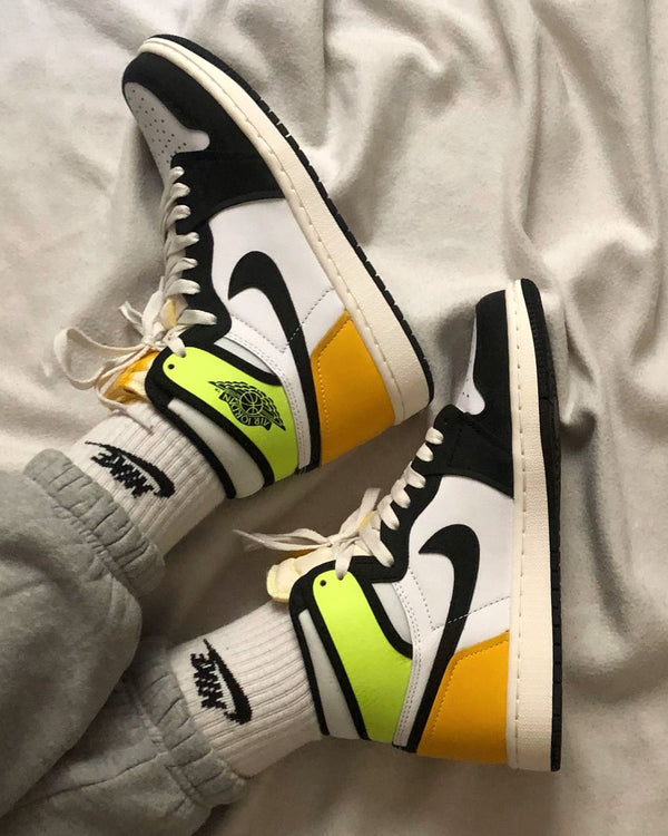 Jordan 1 Retro High White Black Volt University Gold, Lifestyle View 1, SKU 555088-118