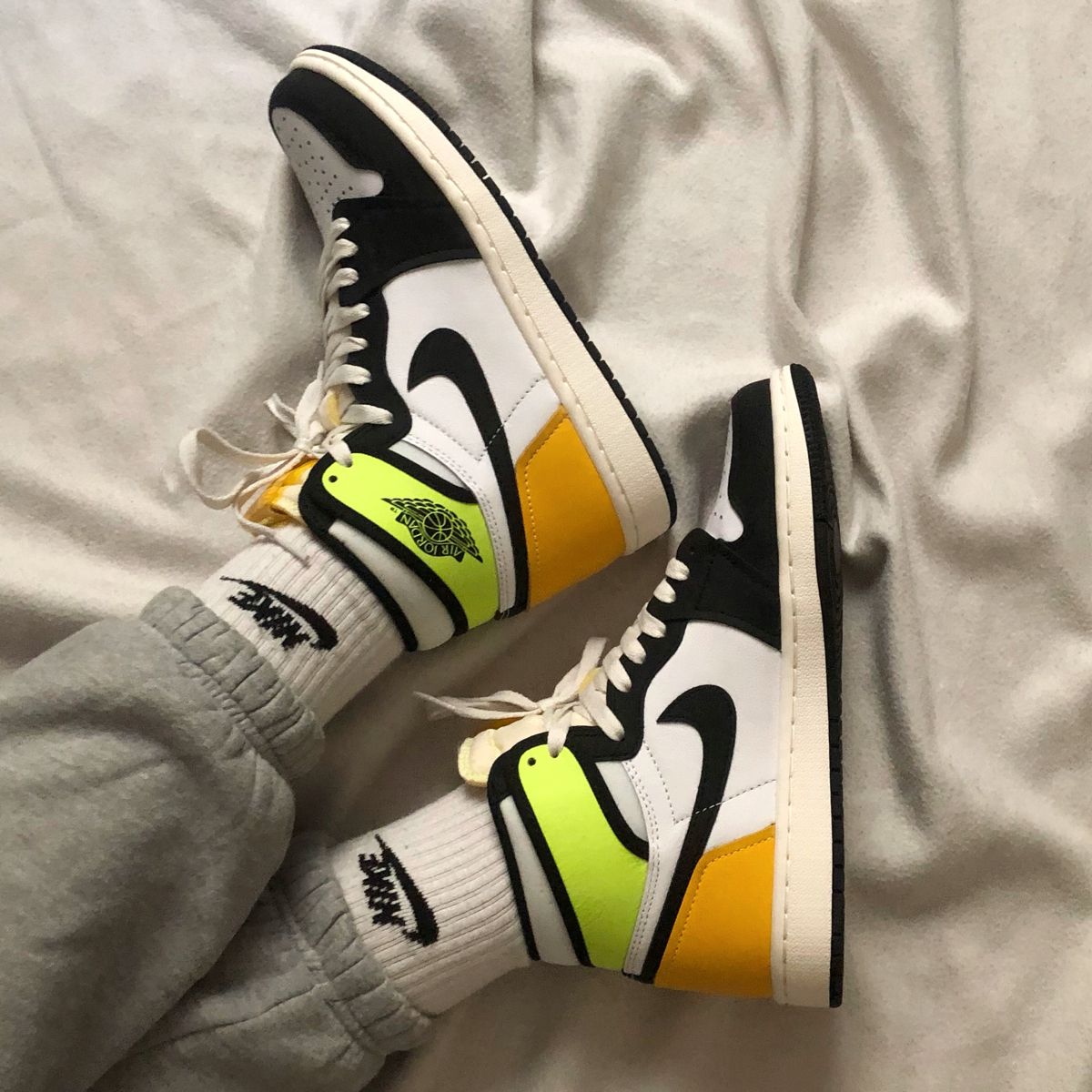 Jordan 1 Retro High White Black Volt University Gold, Lifestyle View 1, SKU 555088-118