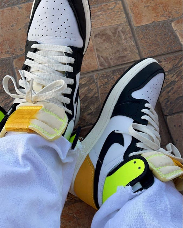 Jordan 1 Retro High White Black Volt University Gold, Lifestyle View 2, SKU 555088-118