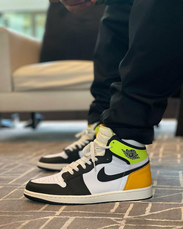 Jordan 1 Retro High White Black Volt University Gold, Lifestyle View 4, SKU 555088-118