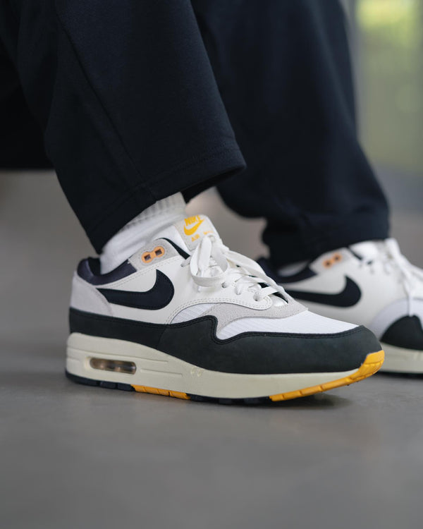 Nike Air Max 1 Athletic Department Light Bone University Gold, Lifestyle View 1, SKU FN7487-133