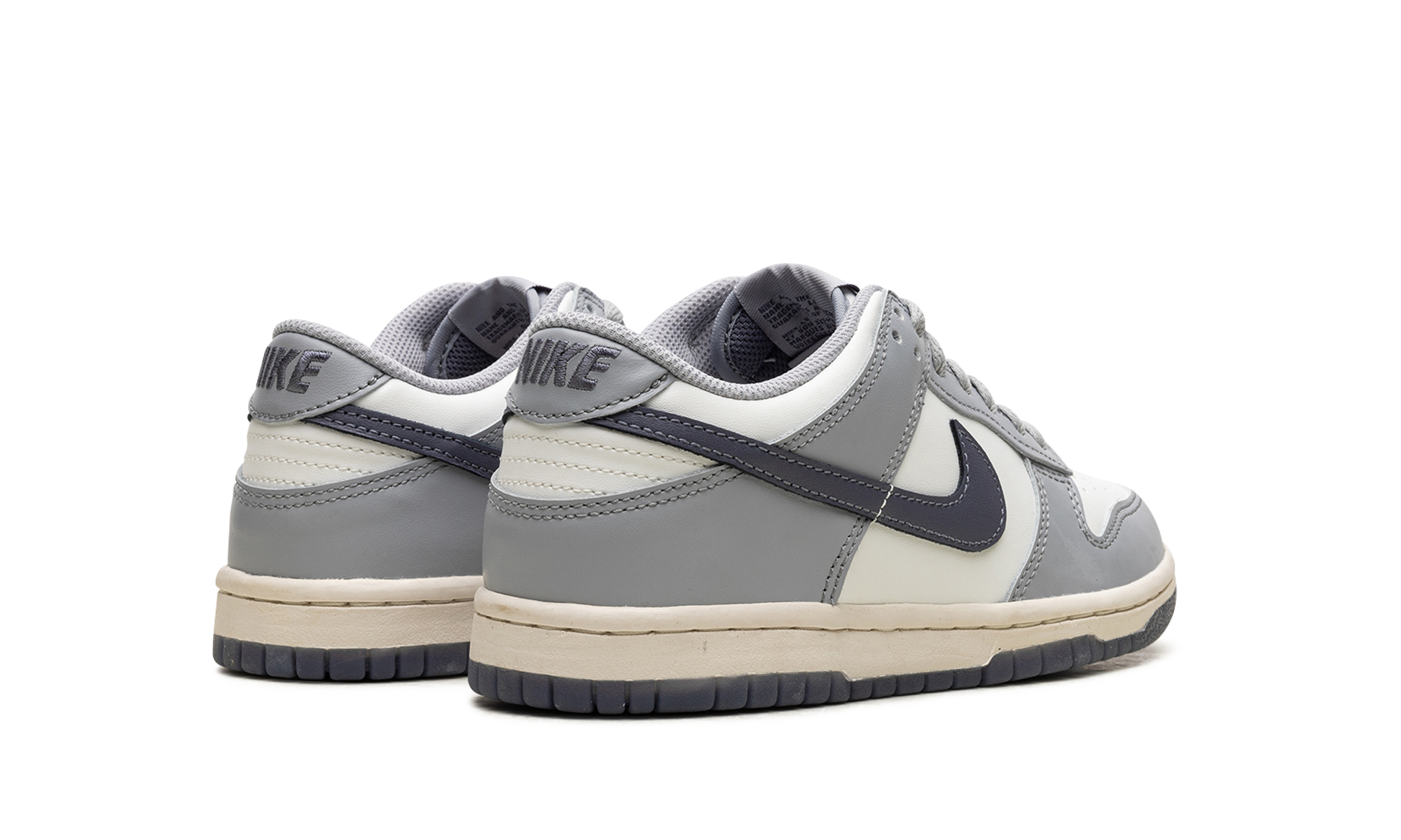 nike dunk low platinum tint light carbon gs+FB9109-101+diagnol right behind view